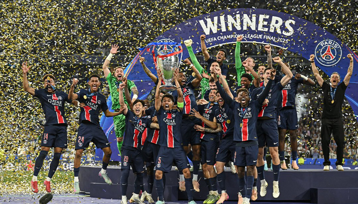 Paris Saint-Germain players celebrating with the UEFA Champions League trophy after their 5-0 win over Inter Milan in the 2025 final.
