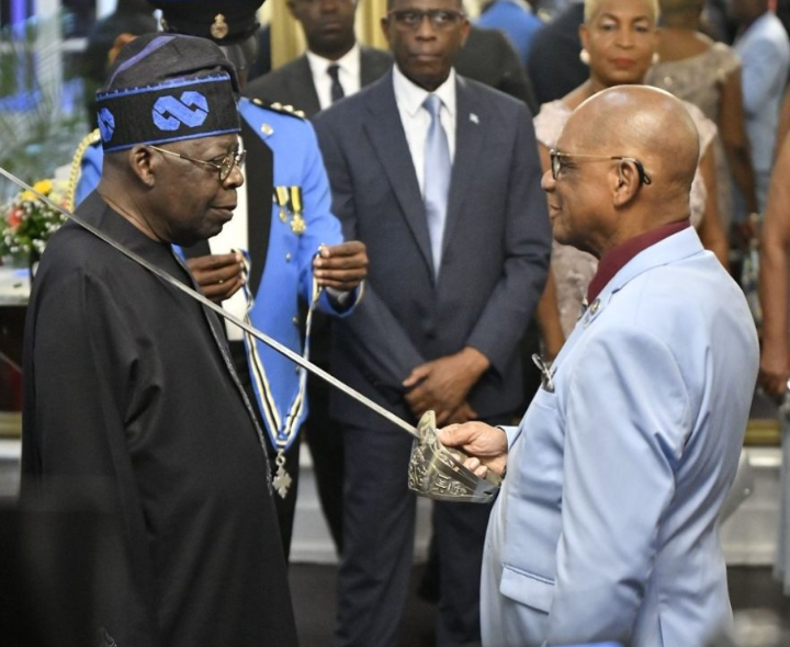 President Bola Tinubu receives the Knight Commander of the Order of Saint Lucia insignia during official ceremony
